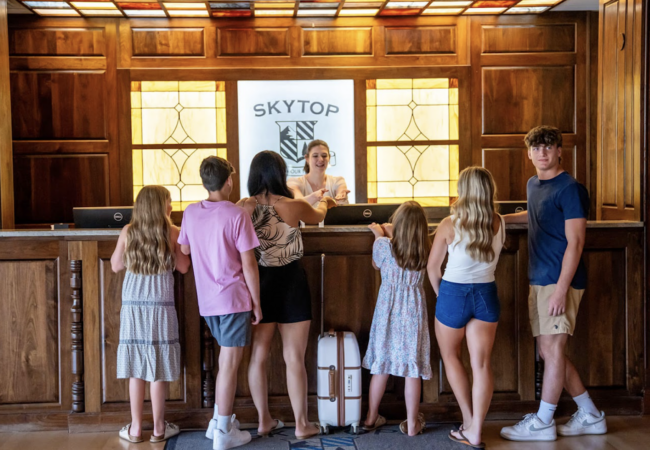 A family checking into a hotel